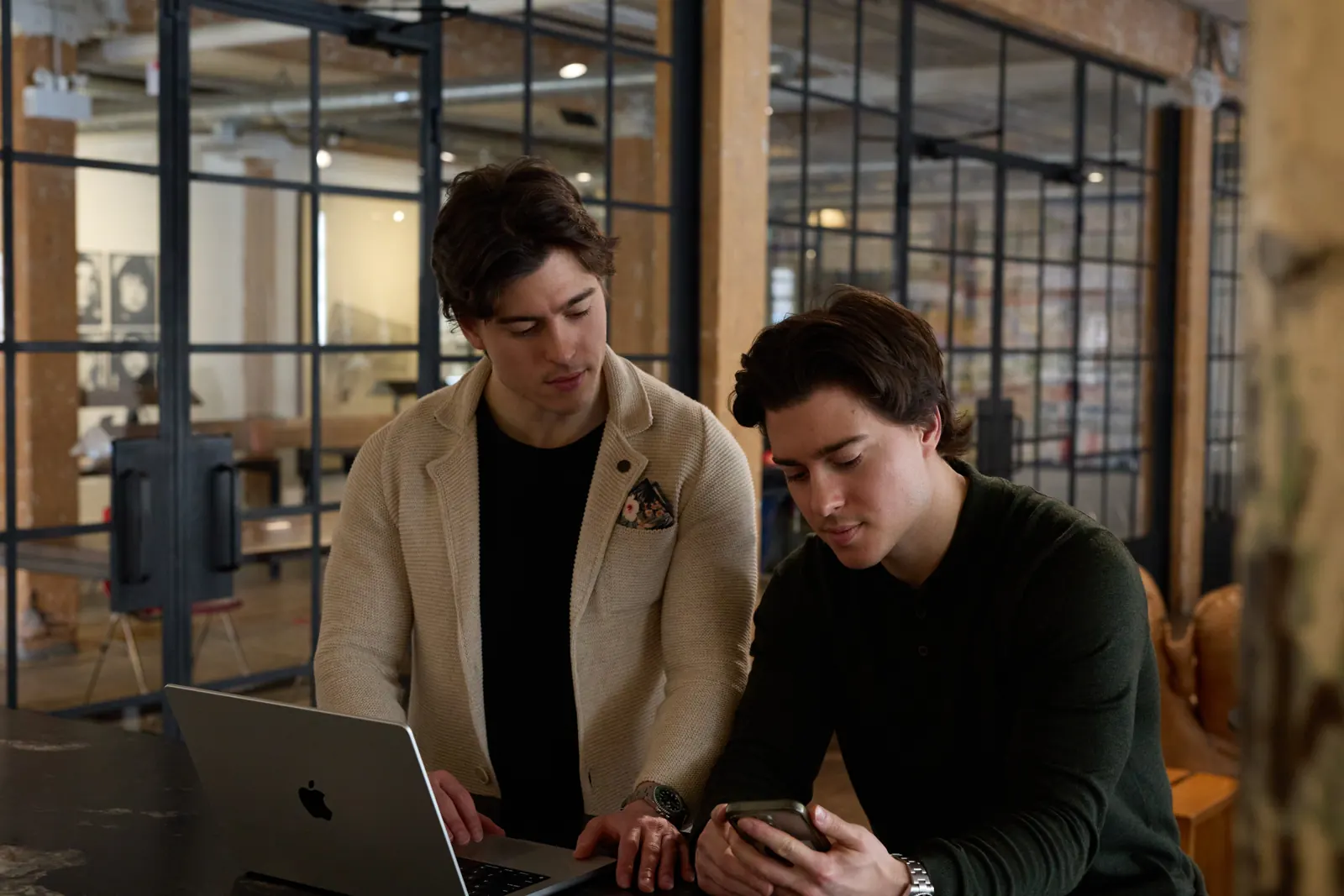 Michael and Stephen Fiorucci reviewing details at a table